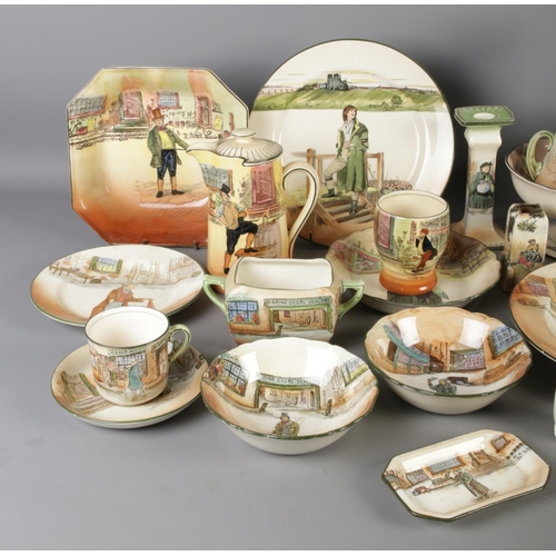 3 - A very large collection of Royal Doulton Dickens Ware ceramics, including a pair of candlesticks (Fa... 