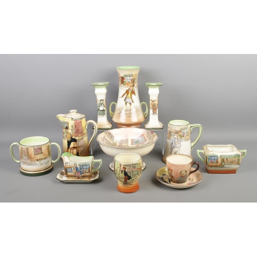 3 - A very large collection of Royal Doulton Dickens Ware ceramics, including a pair of candlesticks (Fa... 