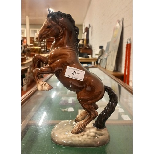 401 - Two Beswick ceramic figures to include Bison model 1019 and rearing Welsh Cob horse model 1014.