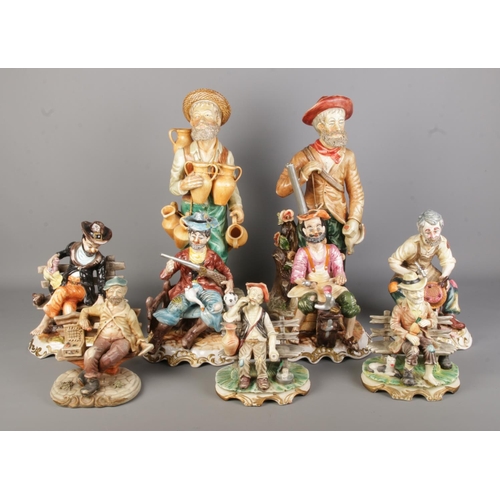 119 - A quantity of Capodimonte and Capodimonte style ceramic figures, including two large examples.