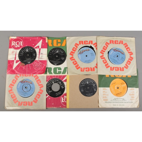 126 - A collection of Elvis Presley records along with an Elvis Complete song book. Records include Greate... 