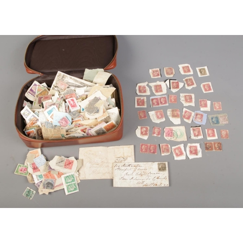 14 - A good collection of assorted loose world stamps to include 30 Victorian Penny Reds, East India Post... 