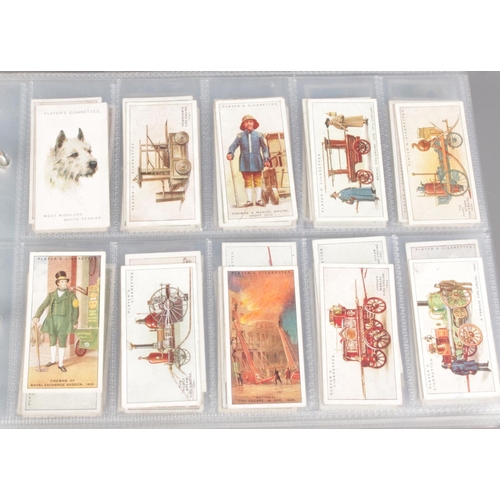 160 - Three albums featuring themed sets of vintage cigarette cards, along with a bag of loose cards. Prim... 