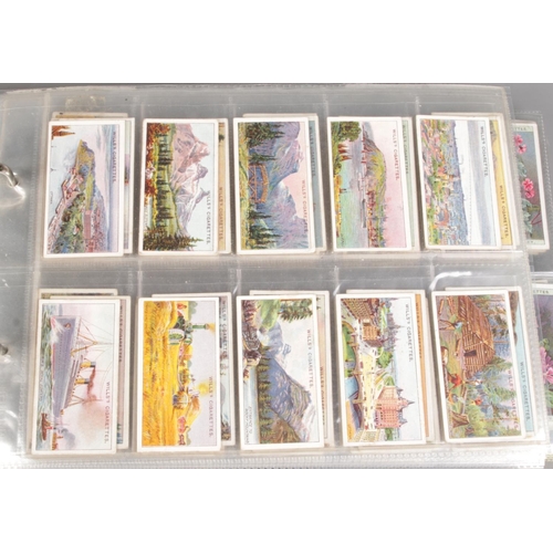 163 - Three albums featuring themed sets of vintage cigarette cards, along with a collection of Sheffield ... 