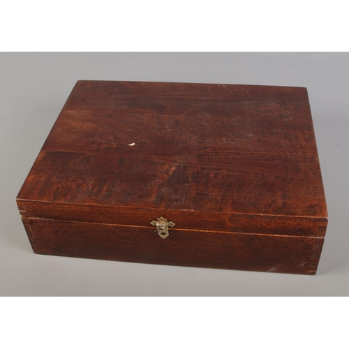 27 - A wooden box of assorted items, including silver-plated pieces, costume watches and jewellery, and v... 