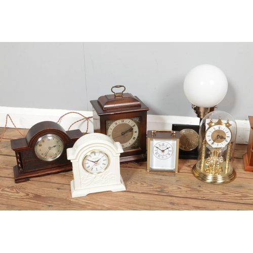 217 - Two boxes containing a large collection of mechanical and quartz clocks. Including Rapport, Widdop, ... 