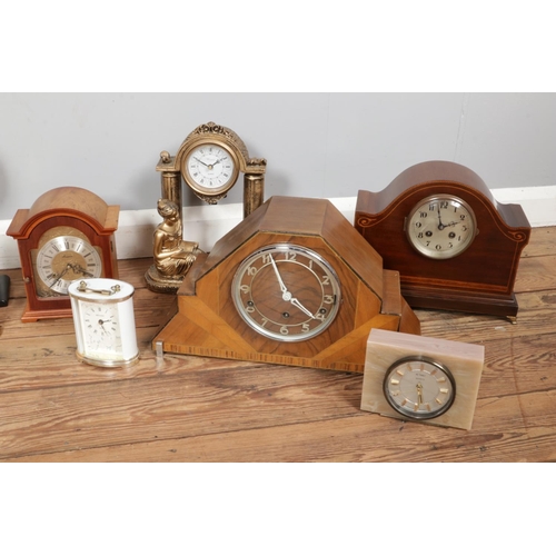 217 - Two boxes containing a large collection of mechanical and quartz clocks. Including Rapport, Widdop, ... 