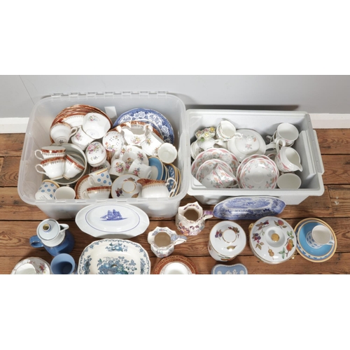 233 - Two boxes containing an assortment of named ceramics, mainly part tea services. To include Royal Wor... 