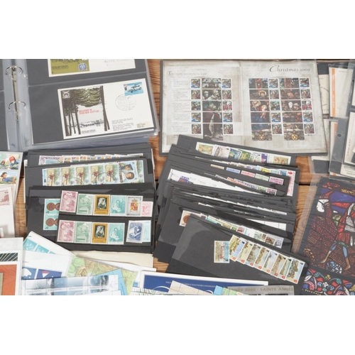 265 - A large collection of stamps and first day covers, including first day cover albums, loose stamp she... 