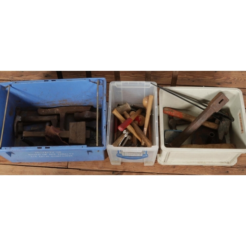 275 - Three boxes containing a large collection of tools, to include forming stake, wooden mallets, hammer... 