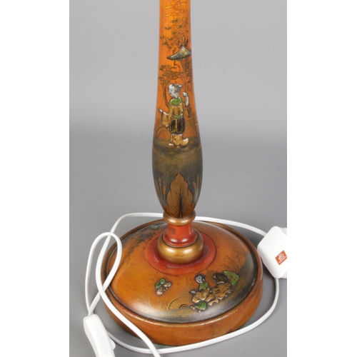 280 - An vintage Chinoiserie table lamp, light wood body and decorated with oriental scenes and figures.