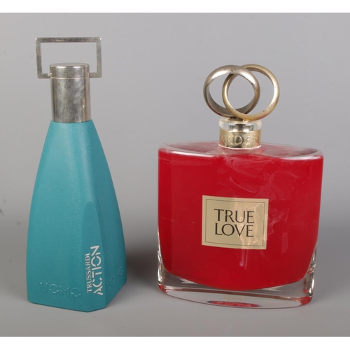 49 - Two large perfume advertising display bottles to include Elizabeth Arden True Love and Trussardi Act... 