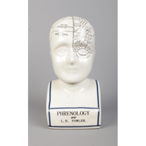 51 - A L.N. Fowler ceramic phrenology head. Height: 29cm.