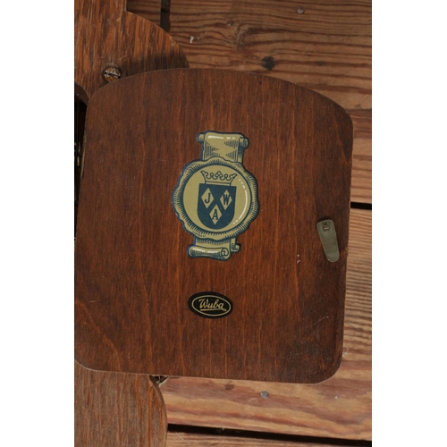 315 - A mahogany cased Wubu John Warmink atlas wall clock, featuring Roman Numeral face and twin weights.