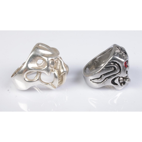 350 - Two skull rings; one stamped S925, the other white metal with red eyes. Sizes T & Y.