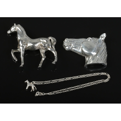 61 - A horse-themed metalware collection, including a 925 silver chain with a white metal horse pendant.