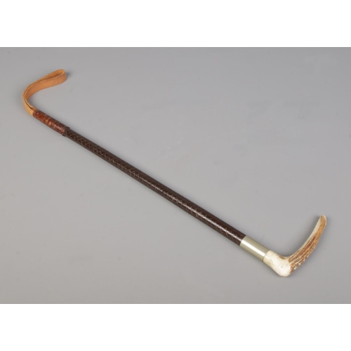 64 - Vintage Riding Crop with antler handle, metal collar and leather grip, total length 44 cm.