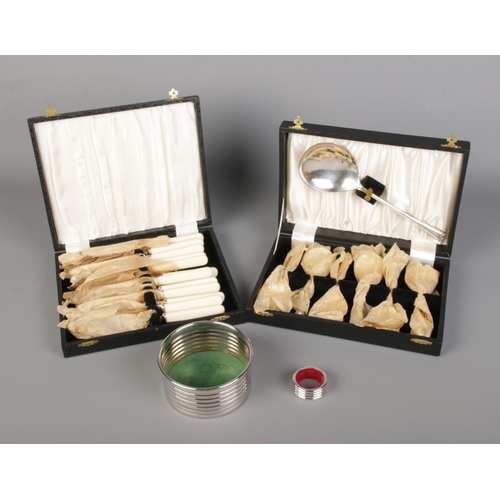 66 - A collection of unused silver plated flatware, wine coaster and wine bottle drip ring.