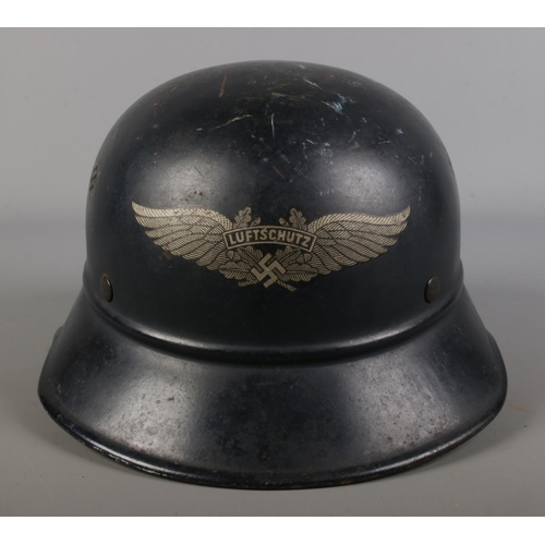 407 - WW2 German Luftschutz gladiator pattern steel helmet, interior with the original leather liner syste... 