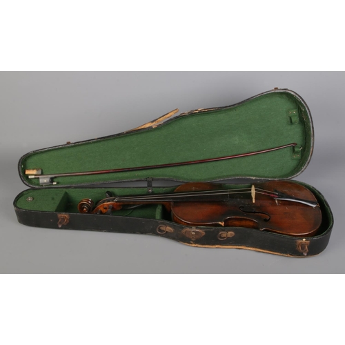 74 - A antique violin featuring 14