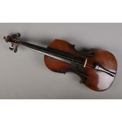 74 - A antique violin featuring 14