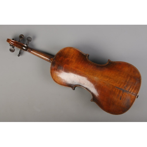 74 - A antique violin featuring 14