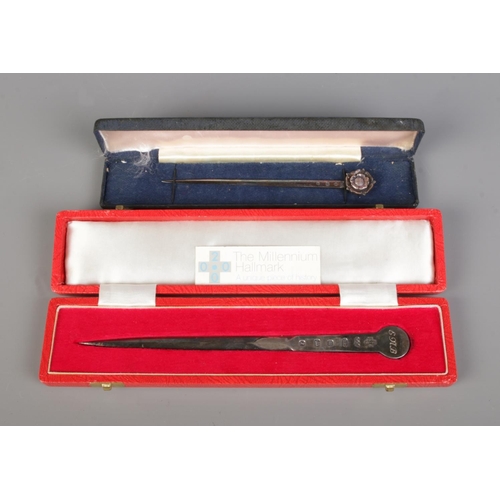 426 - Two cased silver letter openers, one bearing hallmarks for Sheffield, 2000 by White Rose Silverware.... 