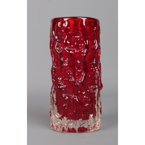 447 - Geoffrey Baxter for Whitefriars; a ruby red moulded glass bark vase of cylindrical form. Height: 15.... 