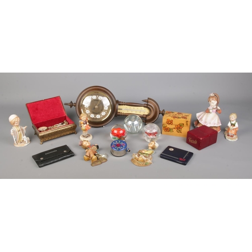 80 - A quantity of collectables, to include glass paperweights, ceramic figures, barometer, playing cards... 