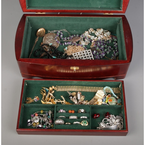 87 - A wooden jewellery box containing silver rings, dress rings and a variety of costume jewellery.