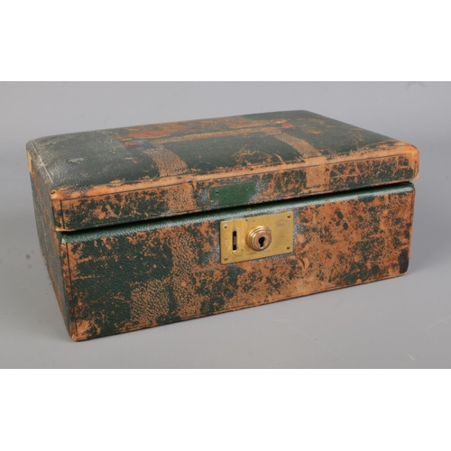 90 - A leather jewellery case, bearing initials E.J.M to the front, containing a quantity of costume jewe... 