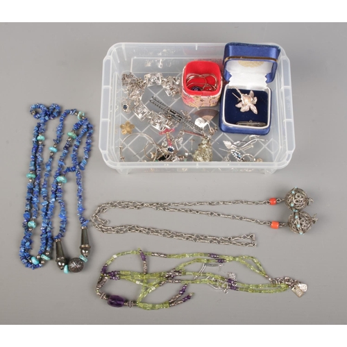 92 - A plastic box containing silver and white metal jewellery, including hallmarked silver necklaces, br... 