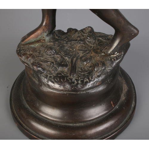 99 - After Rousseau bronze figure depicting young woman with raised hand. Signed to base. Approx. height ... 