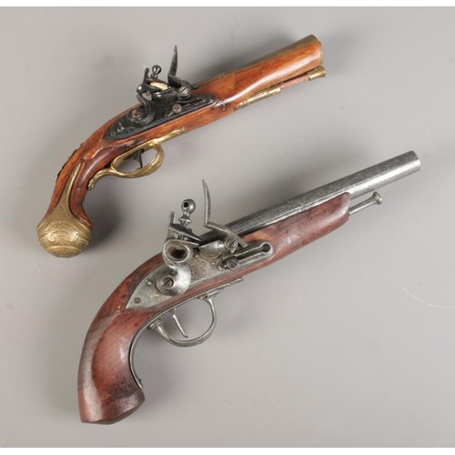 183 - Two replica metal Flintlocks, length 31cm/35cm respectively. CANOT POST OVERSEAS