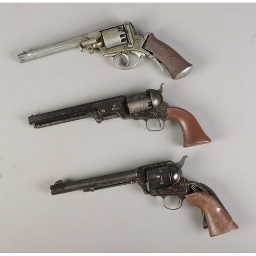 184 - Three replica metal Revolvers, broken grips, for spares and repair, length 31cm/31cm/32cm respective... 