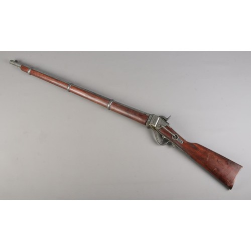 187 - A replica double barrel pinfire shotgun, whole length 98cm. CANNOT POST