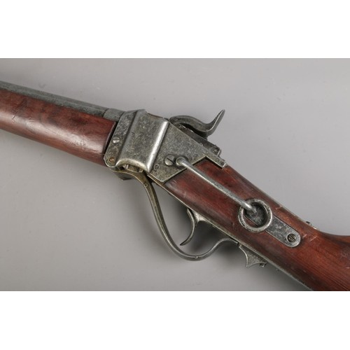 187 - A replica double barrel pinfire shotgun, whole length 98cm. CANNOT POST