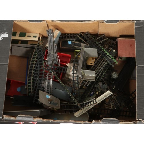 260 - Two boxes of railway modelling metal tracks, power units and other railway buildings etc.