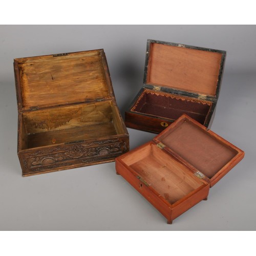 296 - Collection of four antique and vintage wooden boxes, including a writing slope with metal handles on... 