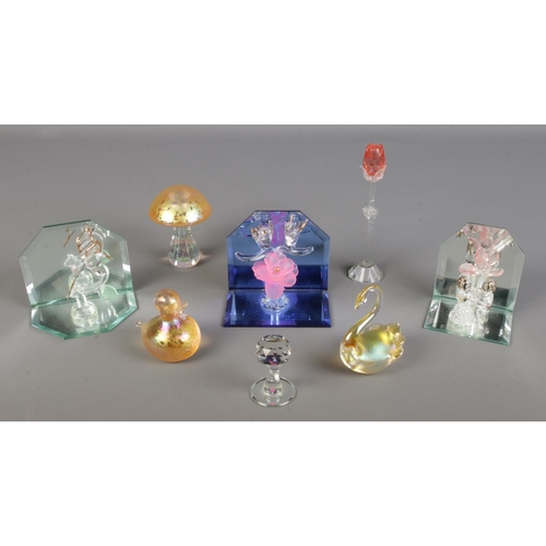 124 - A selection of art and cut glass including Swarovski animals, art glass paper weights, mirrored disp... 