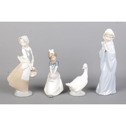 88 - Four NAO by Lladro ceramic figures. Includes sitting girl, goose and girl with egg basket.