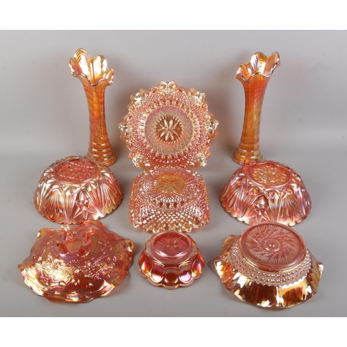 15 - Nine pieces of Carnival glass, including large bowls, vase and dishes etc.