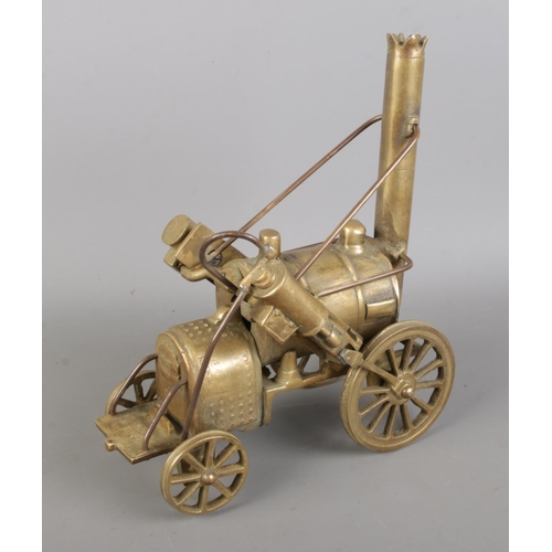 55 - Stephenson's Rocket steam locomotive, brass model of a steam engine with carriage and barrel.