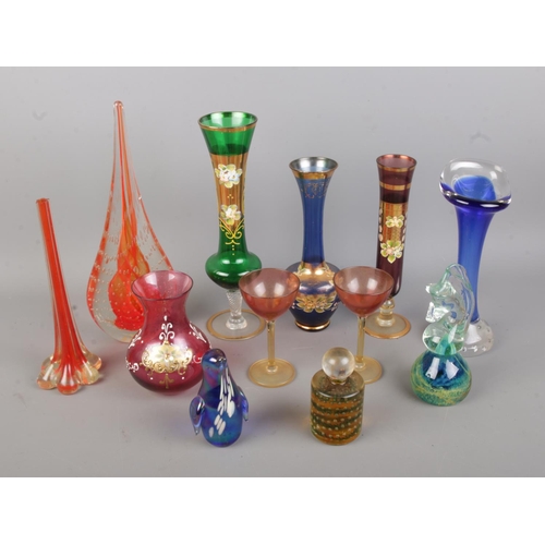 68 - A collection of assorted art glass to include Mdina seahorse paperweight, Murano vase, penguin paper... 