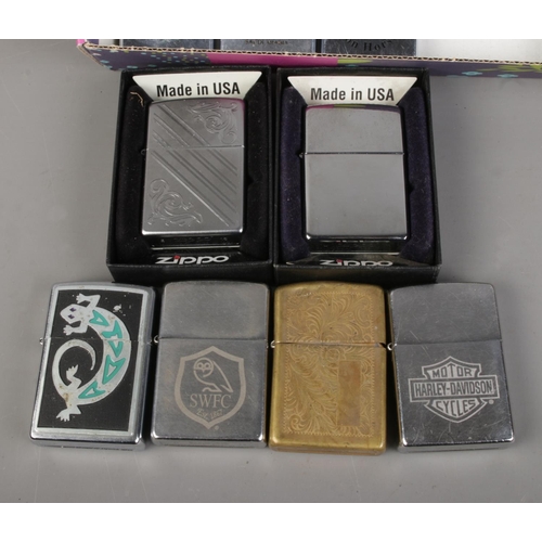 72 - A collection of vintage pocket lighters, including thirteen examples from Zippo and other brands suc... 