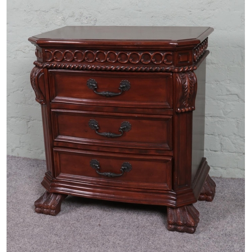 538 - A modern nightstand with three drawers, adorned with leaf motifs and supported by paw feet. W72 x D4... 