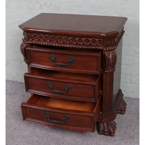 538 - A modern nightstand with three drawers, adorned with leaf motifs and supported by paw feet. W72 x D4... 