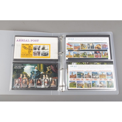 105 - A partially full album containing a collection of Royal Mail Presentation Packs. To include 2012 Oly... 