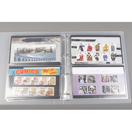 105 - A partially full album containing a collection of Royal Mail Presentation Packs. To include 2012 Oly... 