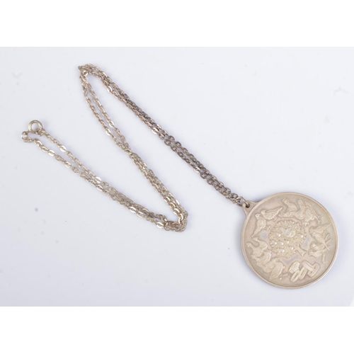 431 - A silver 'Twelve Days of Christmas' Pendant, in case, on silver chain. Total weight: 58.7g